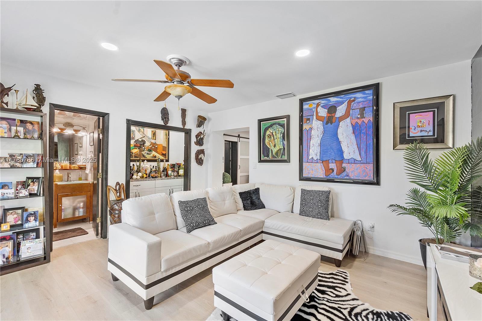 12555 Southwest 31st Street Miami, FL 33175 - Photo 18 of 47 a living room with furniture ceiling fan and a rug