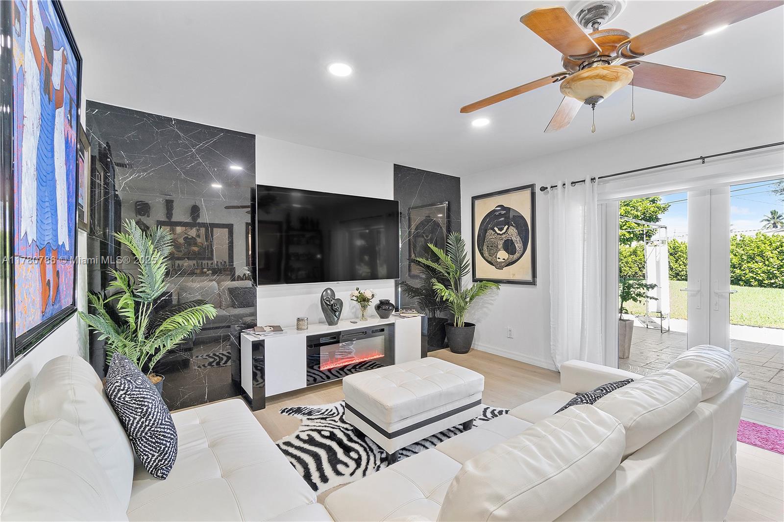 12555 Southwest 31st Street Miami, FL 33175 - Photo 19 of 47 a living room with furniture and a large window