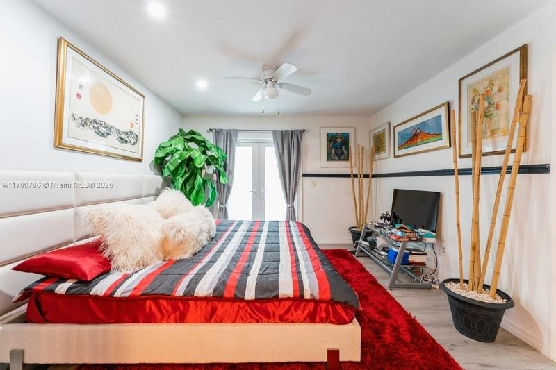 12555 Southwest 31st Street Miami, FL 33175 - Photo 22 of 47 a bed room with a bed and a flat screen tv