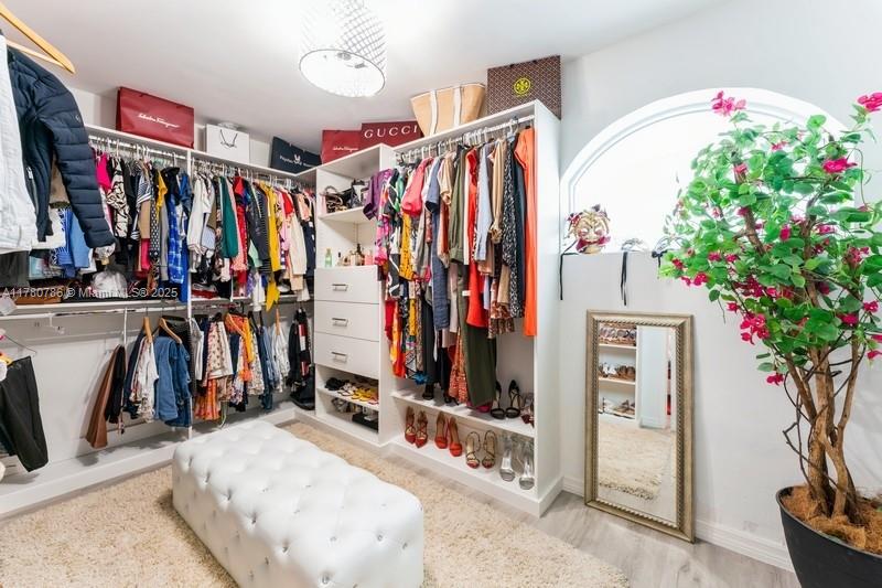 12555 Southwest 31st Street Miami, FL 33175 - Photo 23 of 47 a view of walk in closet with clothes