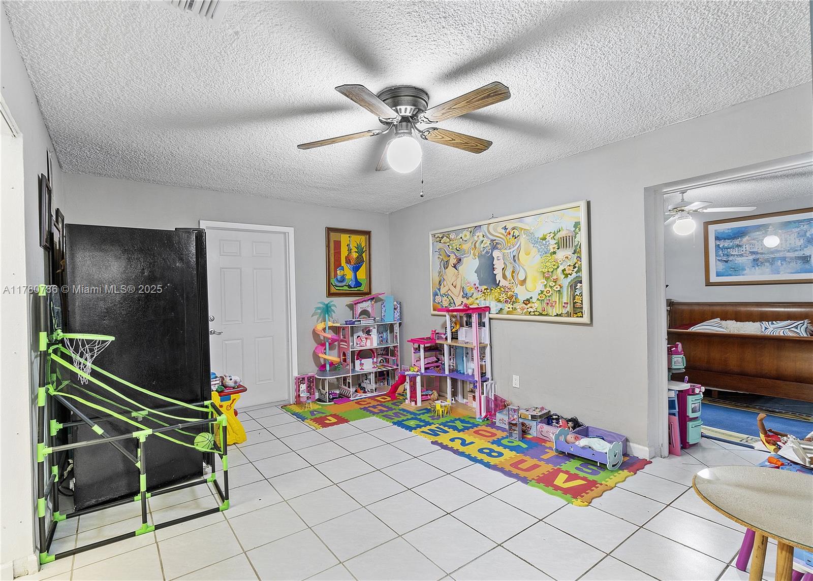 12555 Southwest 31st Street Miami, FL 33175 - Photo 29 of 47 a living room with lots of furniture and a flat screen tv
