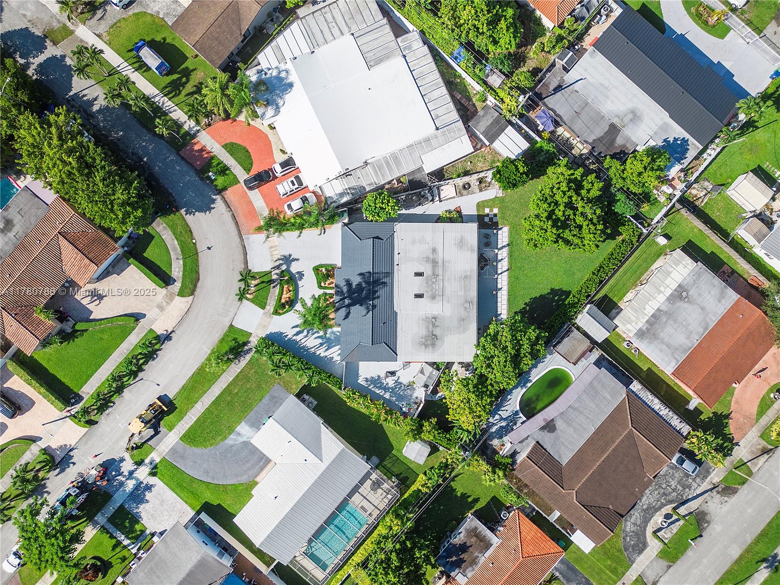 12555 Southwest 31st Street Miami, FL 33175 - Photo 31 of 47 an aerial view of a house with a yard and outdoor seating