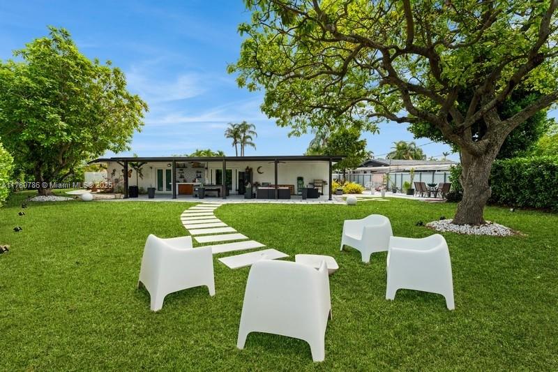 12555 Southwest 31st Street Miami, FL 33175 - Photo 35 of 47 a view of a house with a backyard and a patio