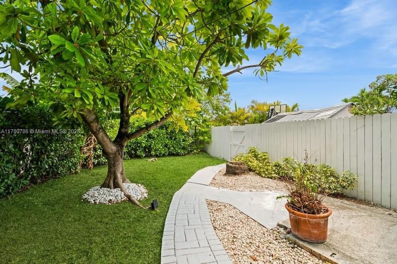 12555 Southwest 31st Street Miami, FL 33175 - Photo 41 of 47 a view of a backyard with plants and a fountain