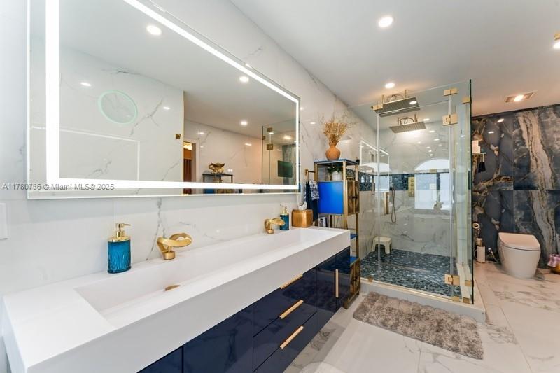 12555 Southwest 31st Street Miami, FL 33175 - Photo 5 of 47 a bathroom with a sink a large mirror and shower