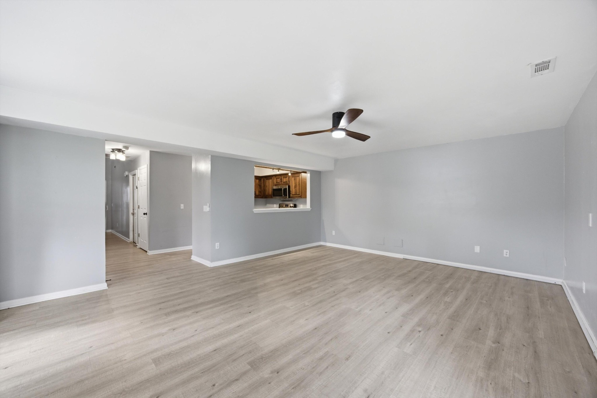 6729 Hickory Trace Circle Chattanooga, TN 37421 - Photo 5 of 30 a view of an empty room with window and wooden floor