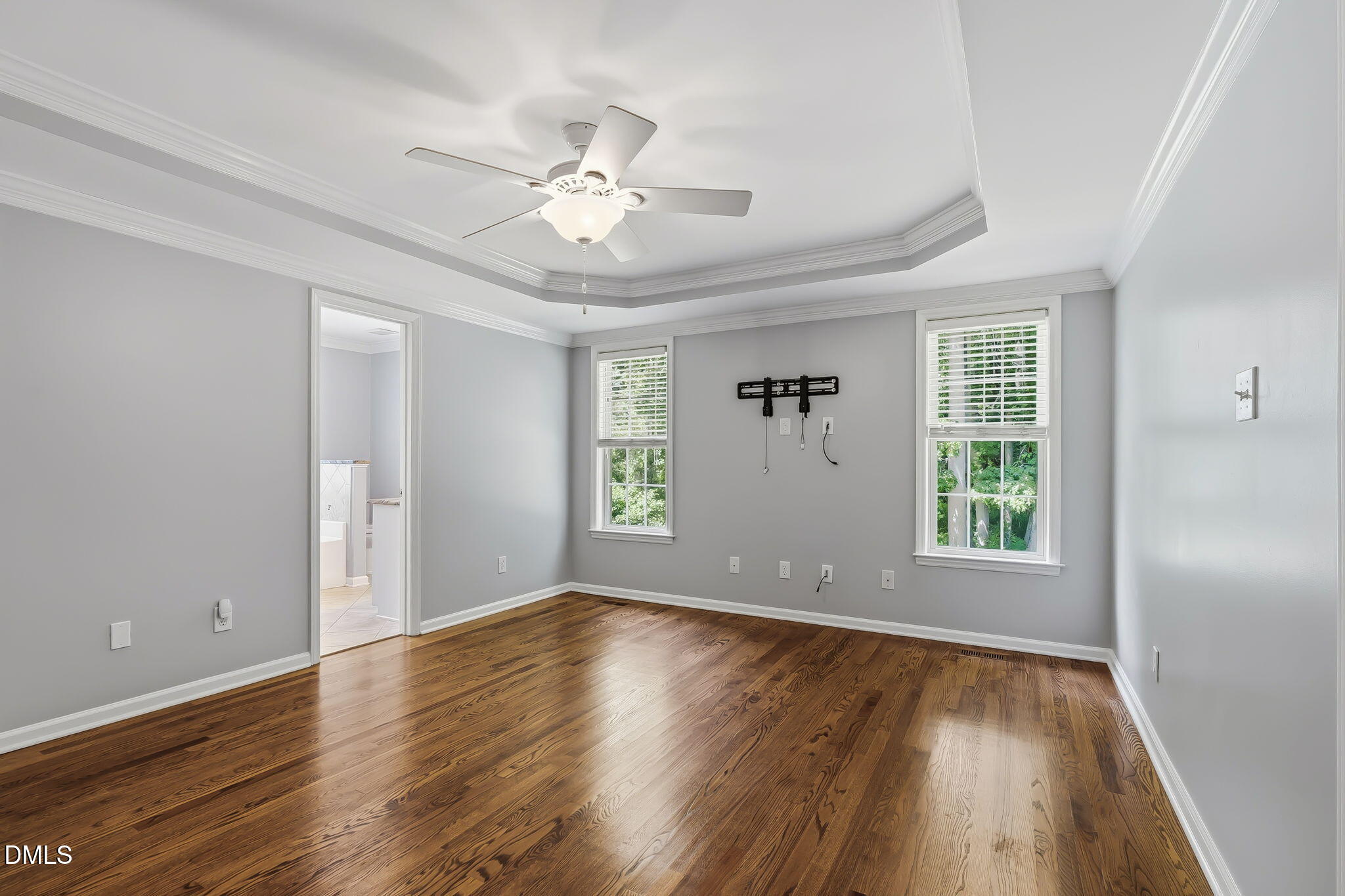 1112 Tyler Farms Drive Raleigh, NC 27603 - Photo 27 of 78 a view of an empty room with wooden floor and a window