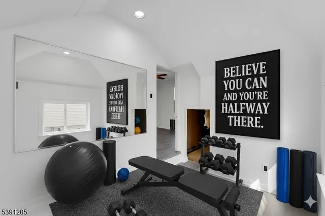 a livingroom with workspace and a couch