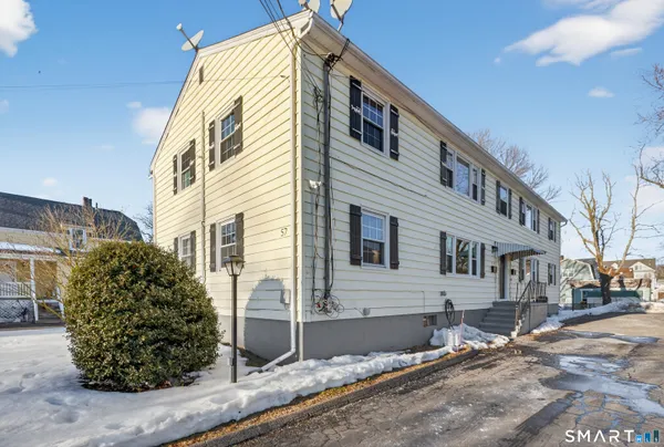 a view of a house with a street