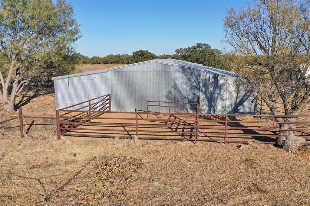 71.63-acres Slusher Road Jacksboro, TX 76458 - Photo 17 of 31 a view of a back yard of the house