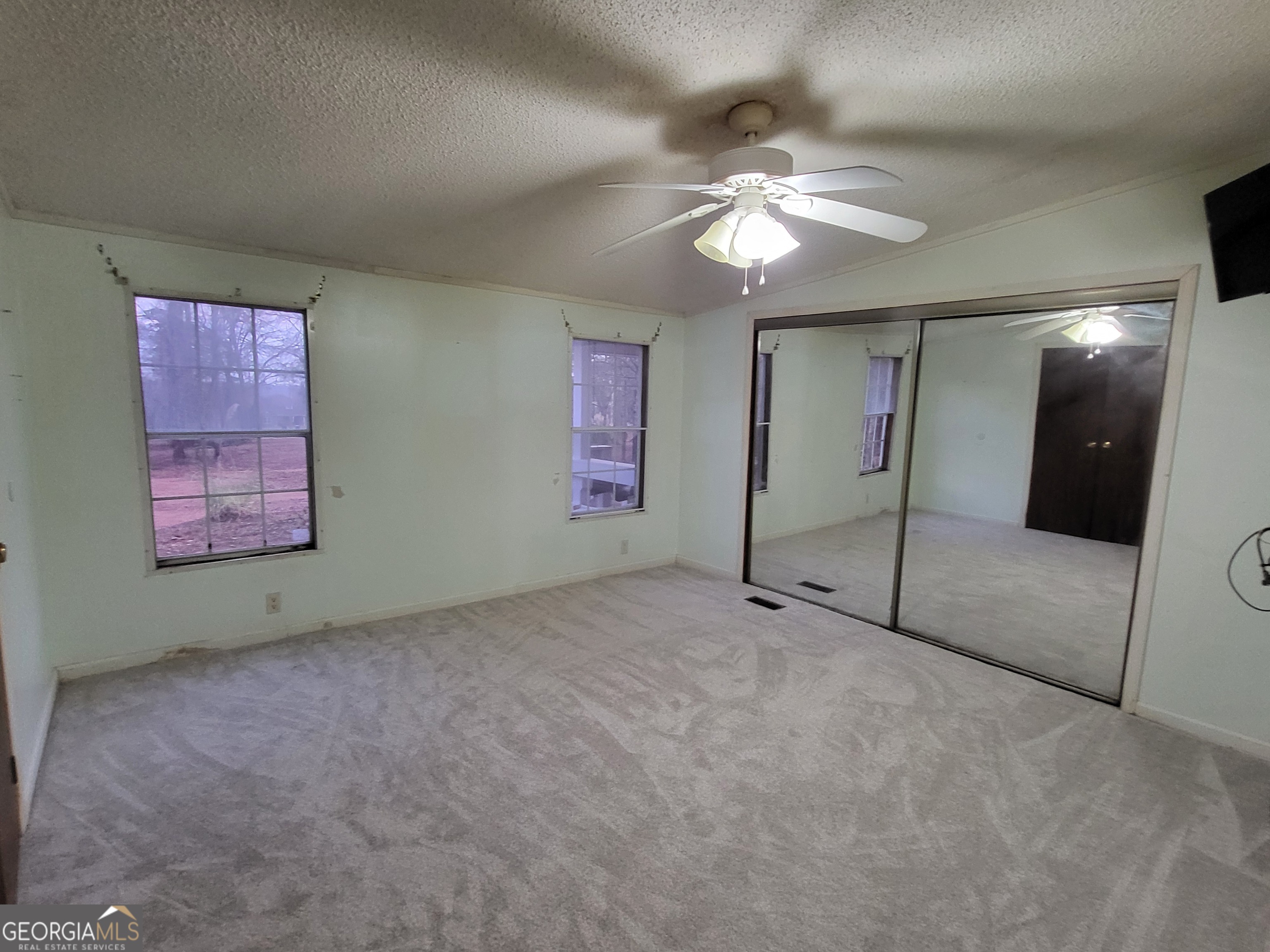 8449 Lee Road Salem, AL 36874 - Photo 16 of 26 a view of an empty room with a chandelier fan