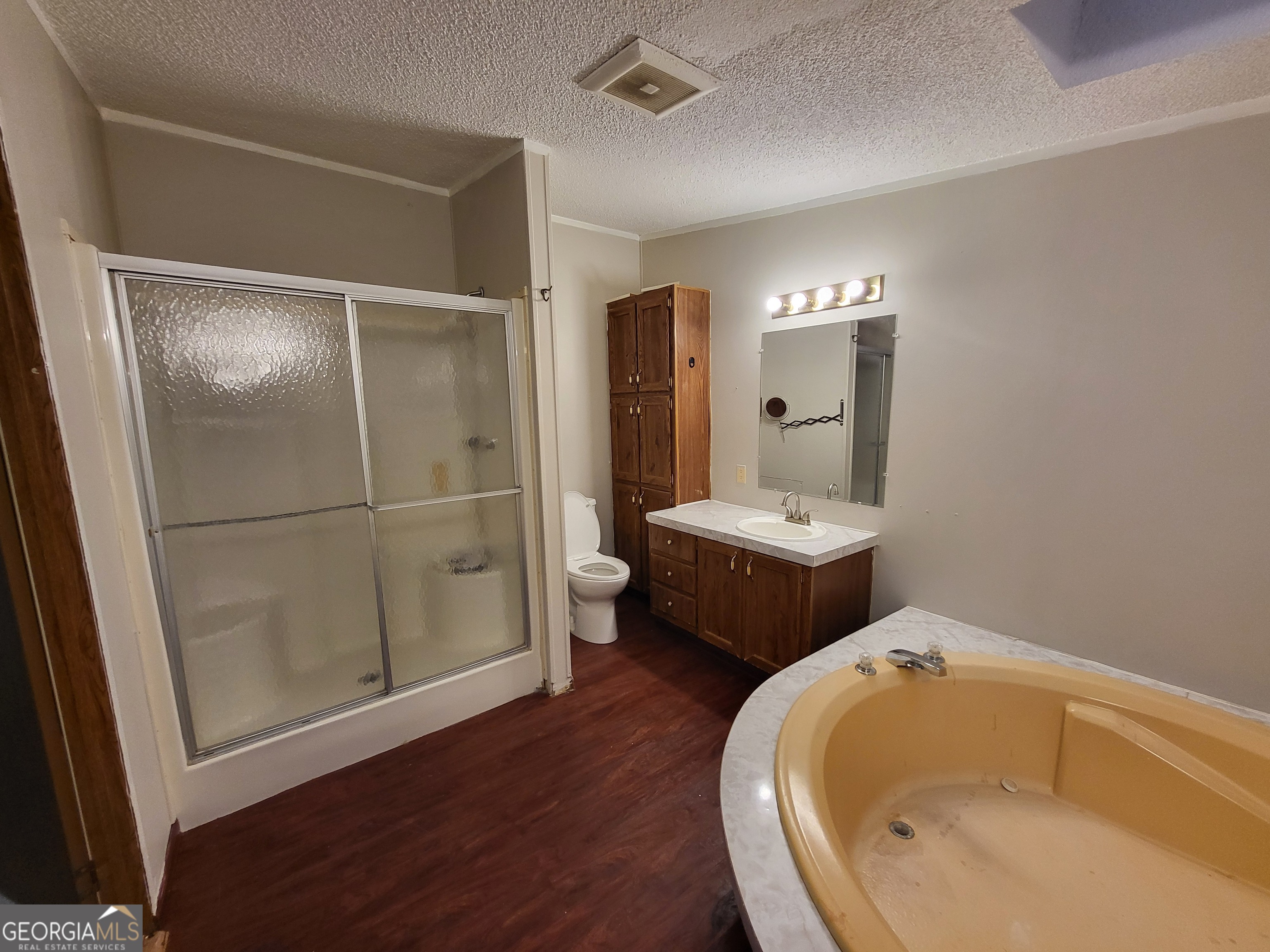 8449 Lee Road Salem, AL 36874 - Photo 17 of 26 a bathroom with a sink and mirror