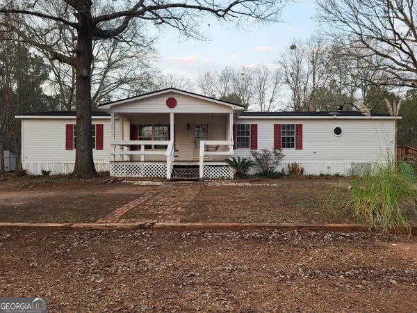 a front view of a house with parking yard