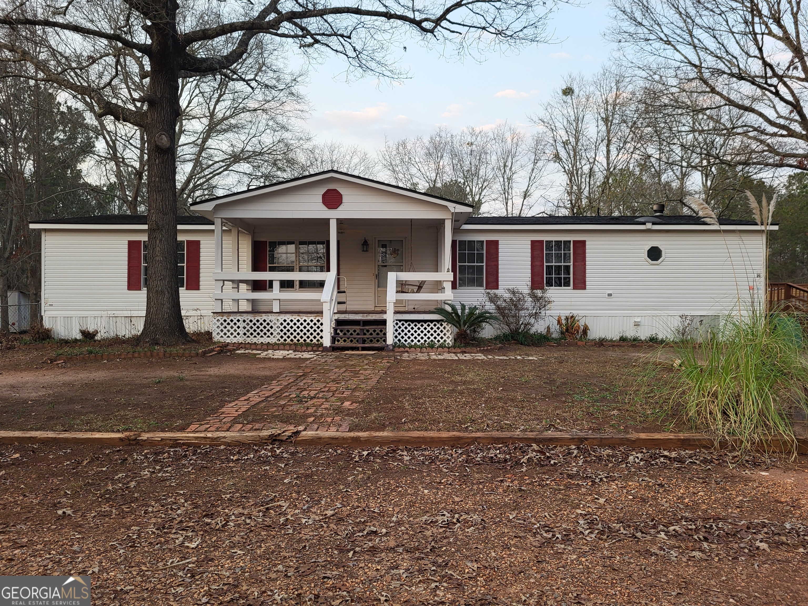 8449 Lee Road Salem, AL 36874 - Photo 2 of 26 a front view of a house with parking yard