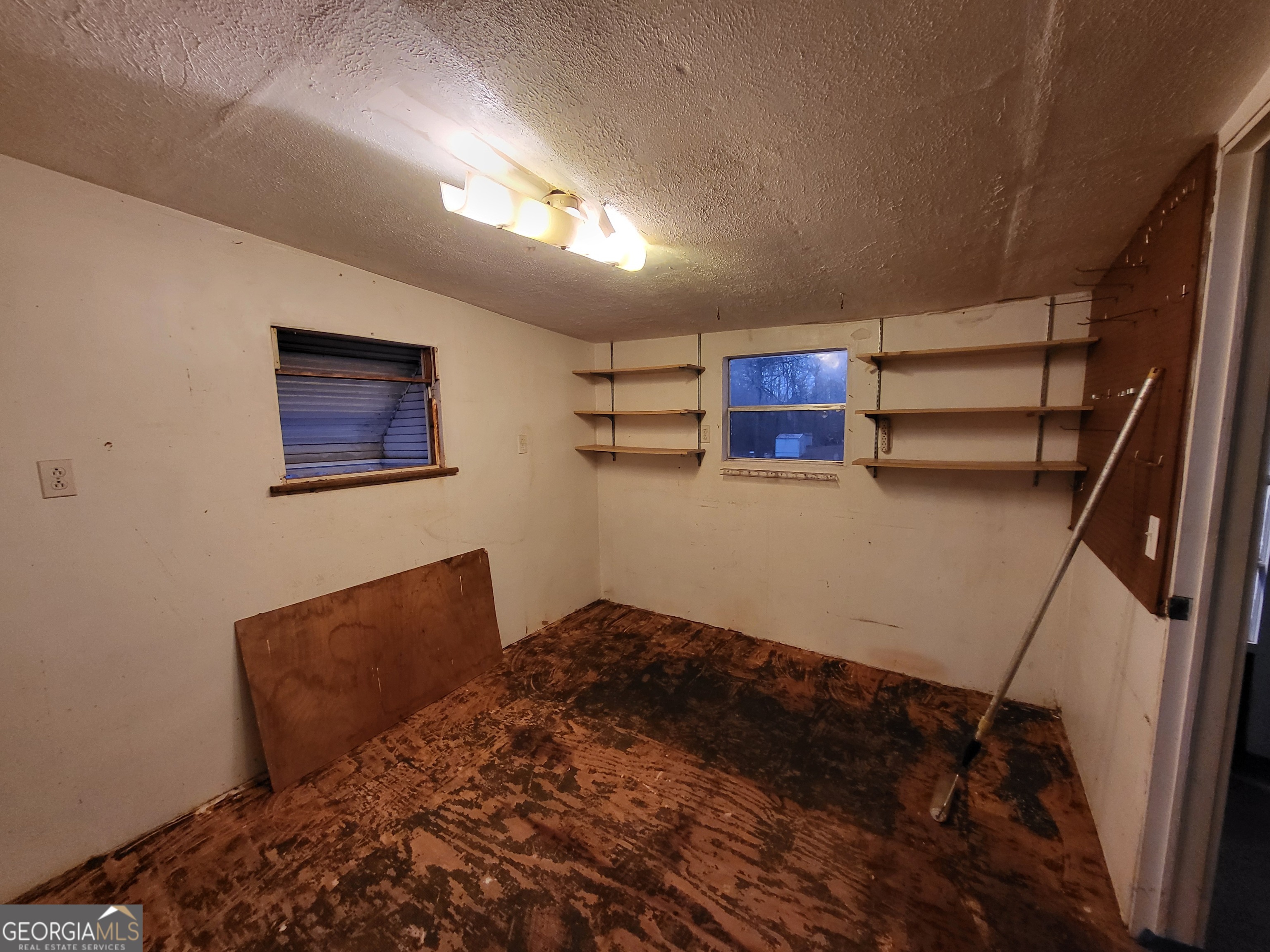 8449 Lee Road Salem, AL 36874 - Photo 26 of 26 a bedroom with bed and cabinets