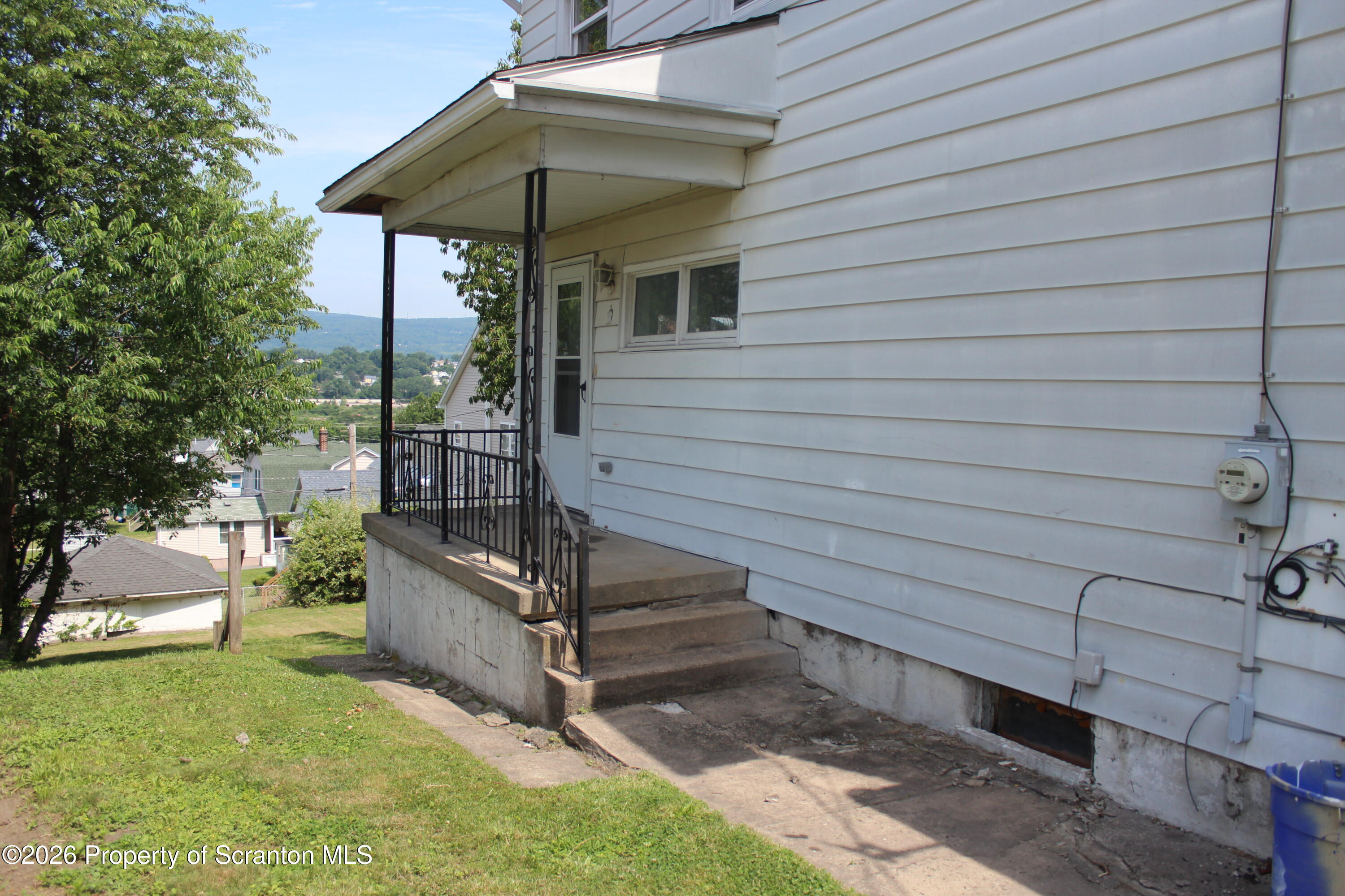 1608 Prospect Avenue Scranton, PA 18505 - Photo 22 of 30 a view of backyard with small cabin and a chair