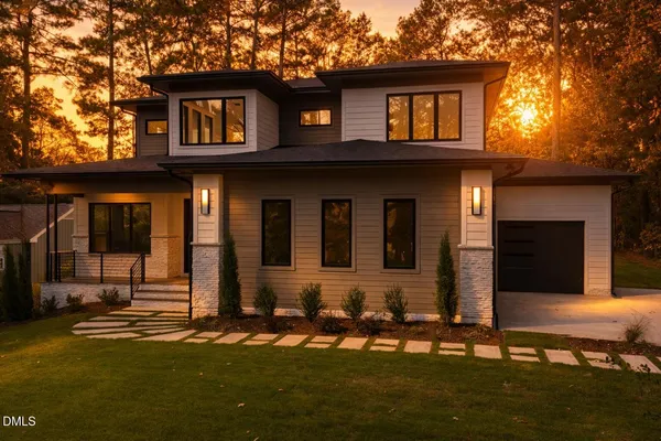 a kitchen with stove a sink and a refrigerator