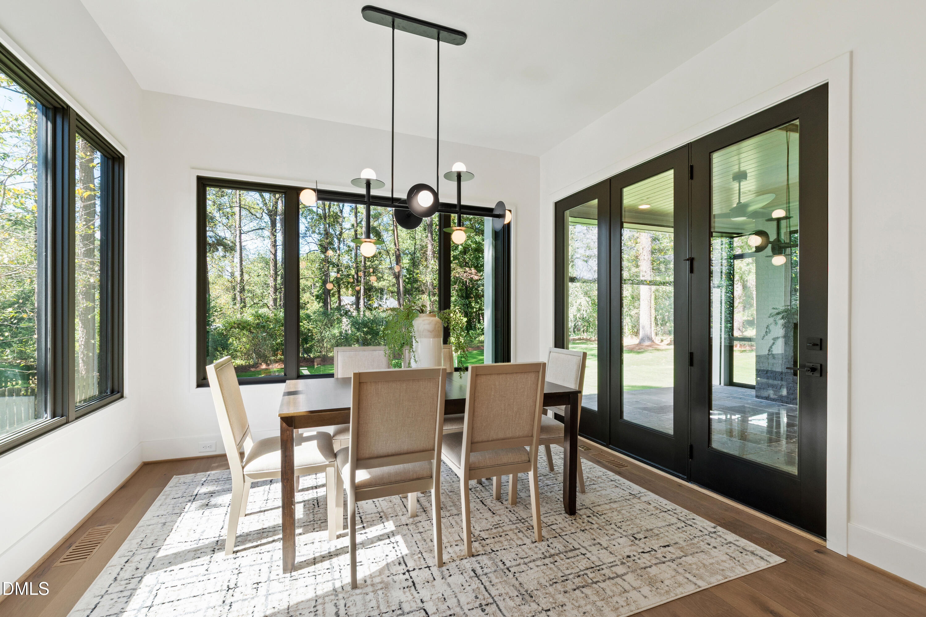 7809 Haymarket Lane Raleigh, NC 27615 - Photo 11 of 62 a view of a dining room with furniture window and wooden floor