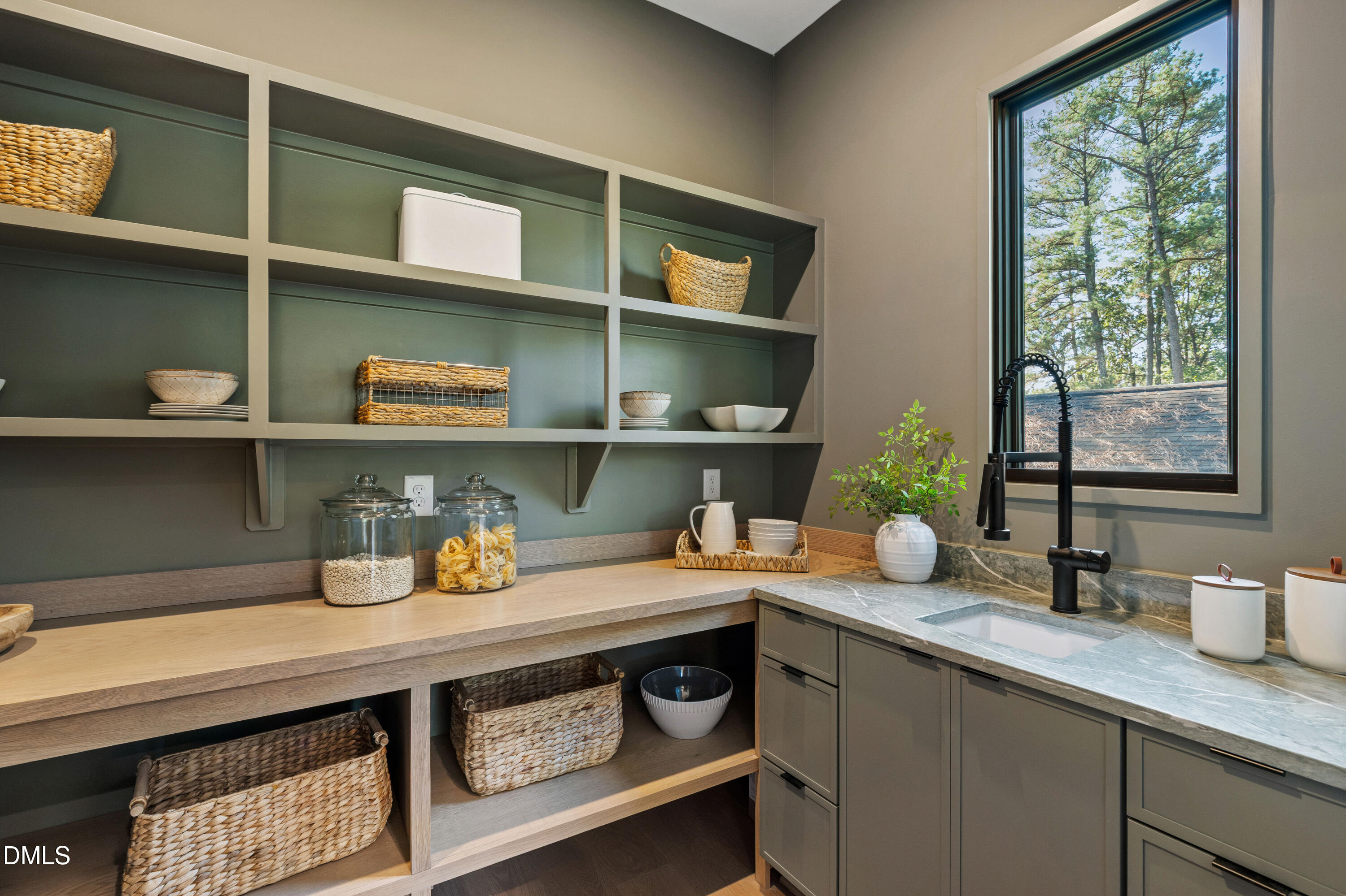 7809 Haymarket Lane Raleigh, NC 27615 - Photo 15 of 62 a kitchen with a sink a stove and a wooden floor