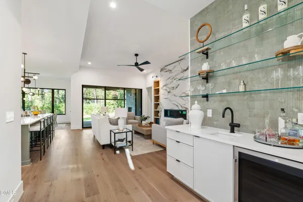 a view of an empty room with a fireplace and a window