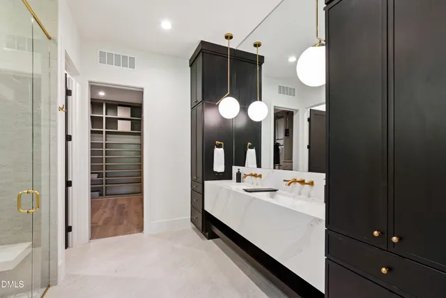 an empty room with a window and a ceiling fan