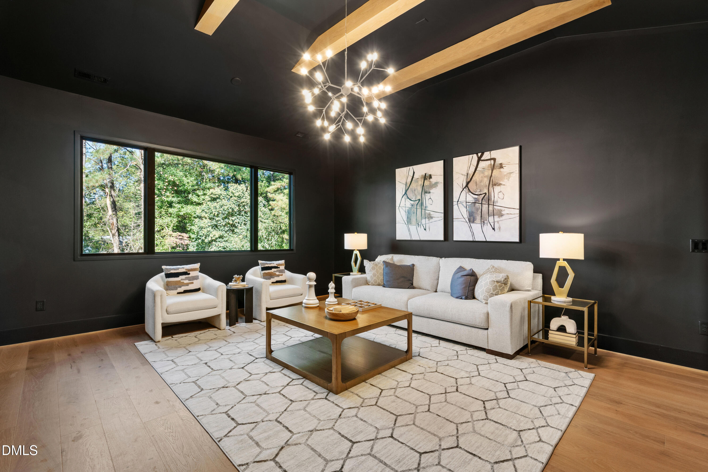 7809 Haymarket Lane Raleigh, NC 27615 - Photo 36 of 62 a living room with furniture and a large window