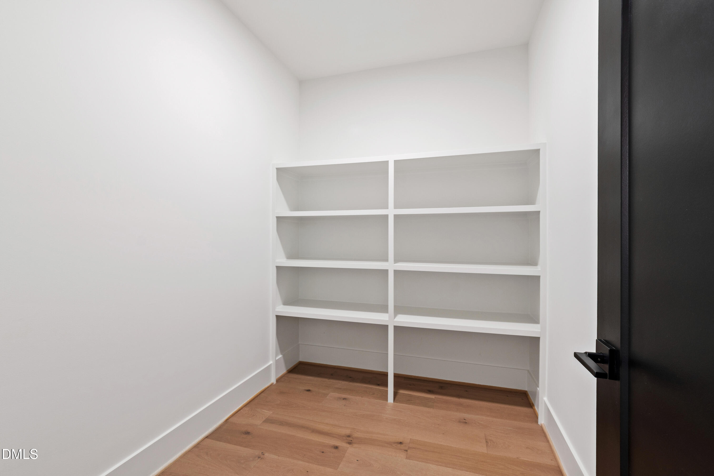 7809 Haymarket Lane Raleigh, NC 27615 - Photo 40 of 62 a view of walk in closet with empty racks