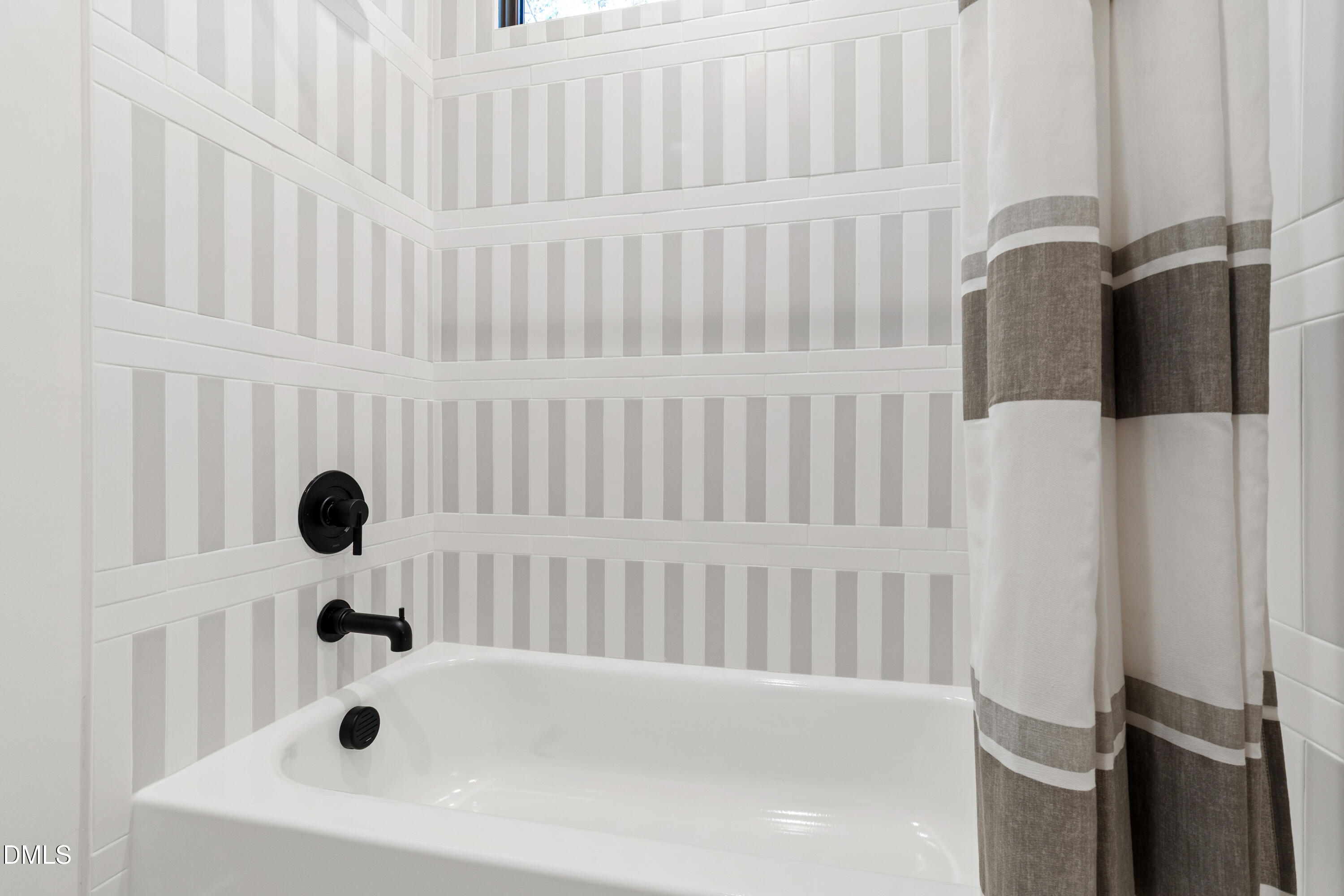 7809 Haymarket Lane Raleigh, NC 27615 - Photo 45 of 62 a bathroom with a bathtub