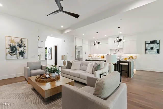a kitchen with stove a sink and a refrigerator