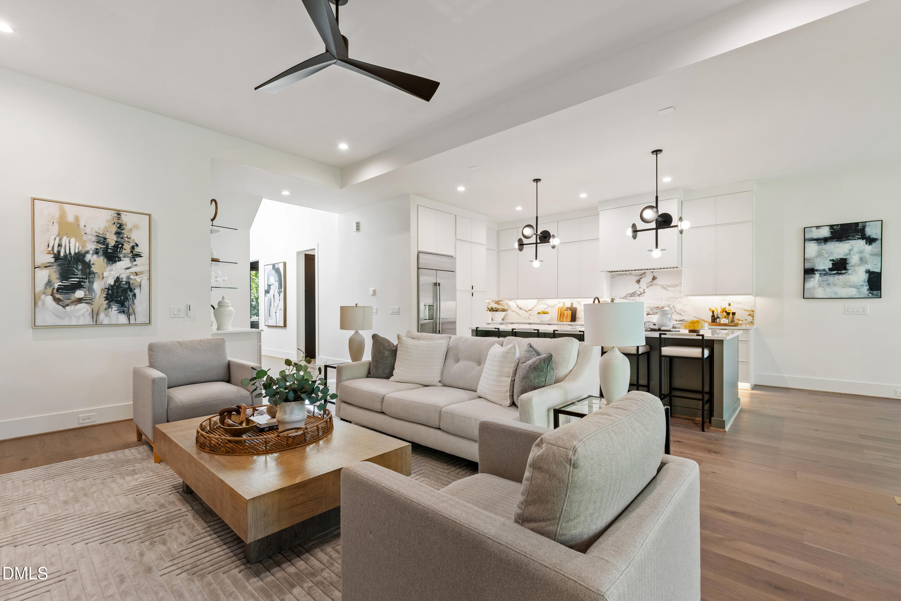 7809 Haymarket Lane Raleigh, NC 27615 - Photo 3 of 62 a living room with furniture kitchen view and a chandelier