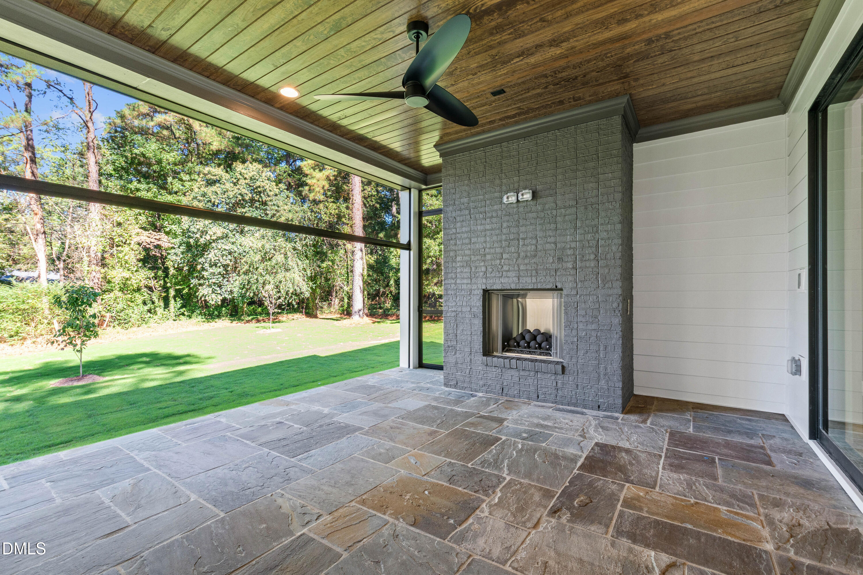 7809 Haymarket Lane Raleigh, NC 27615 - Photo 53 of 62 a view of an empty room with a fireplace and a window