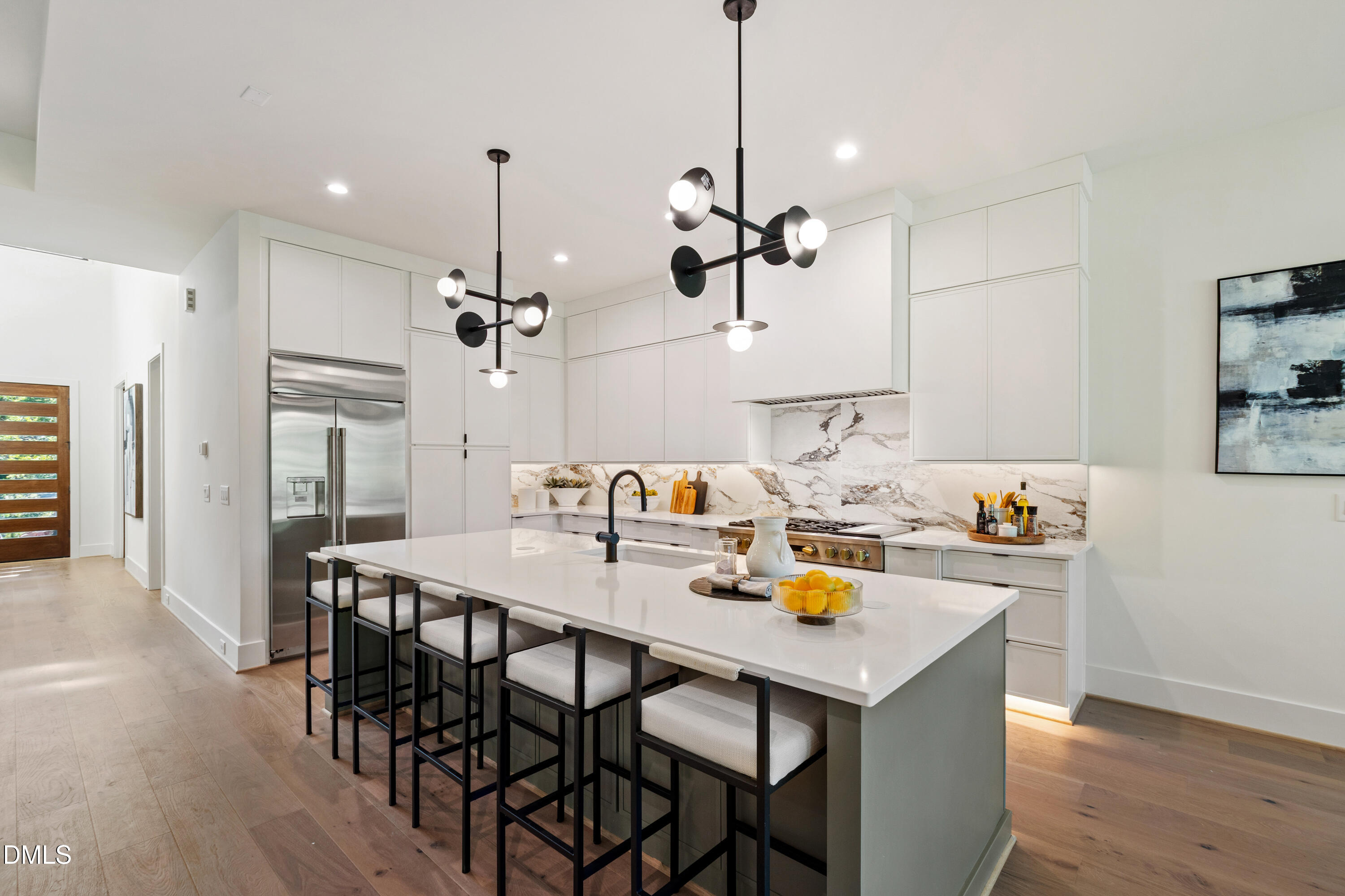 7809 Haymarket Lane Raleigh, NC 27615 - Photo 5 of 62 a view of a dining room with furniture and wooden floor
