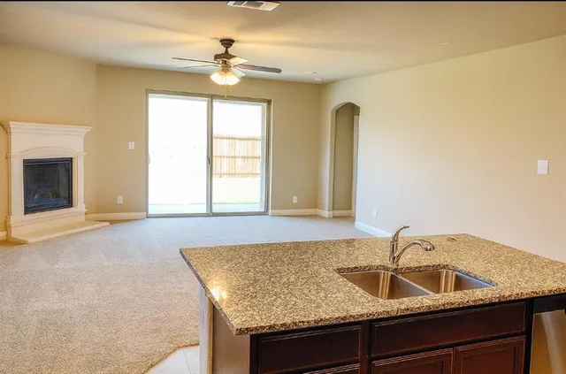 a kitchen with a sink and a window