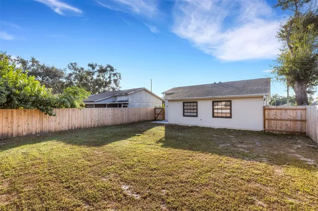an aerial view of a house having yard