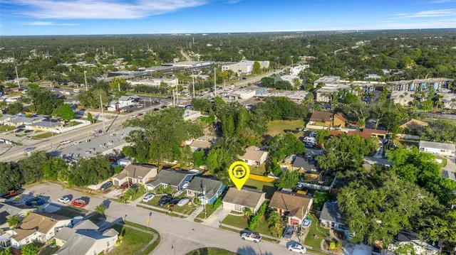 an aerial view of residential houses with outdoor space