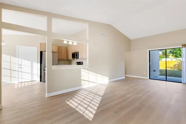 a view of a kitchen cabinets and wooden floor