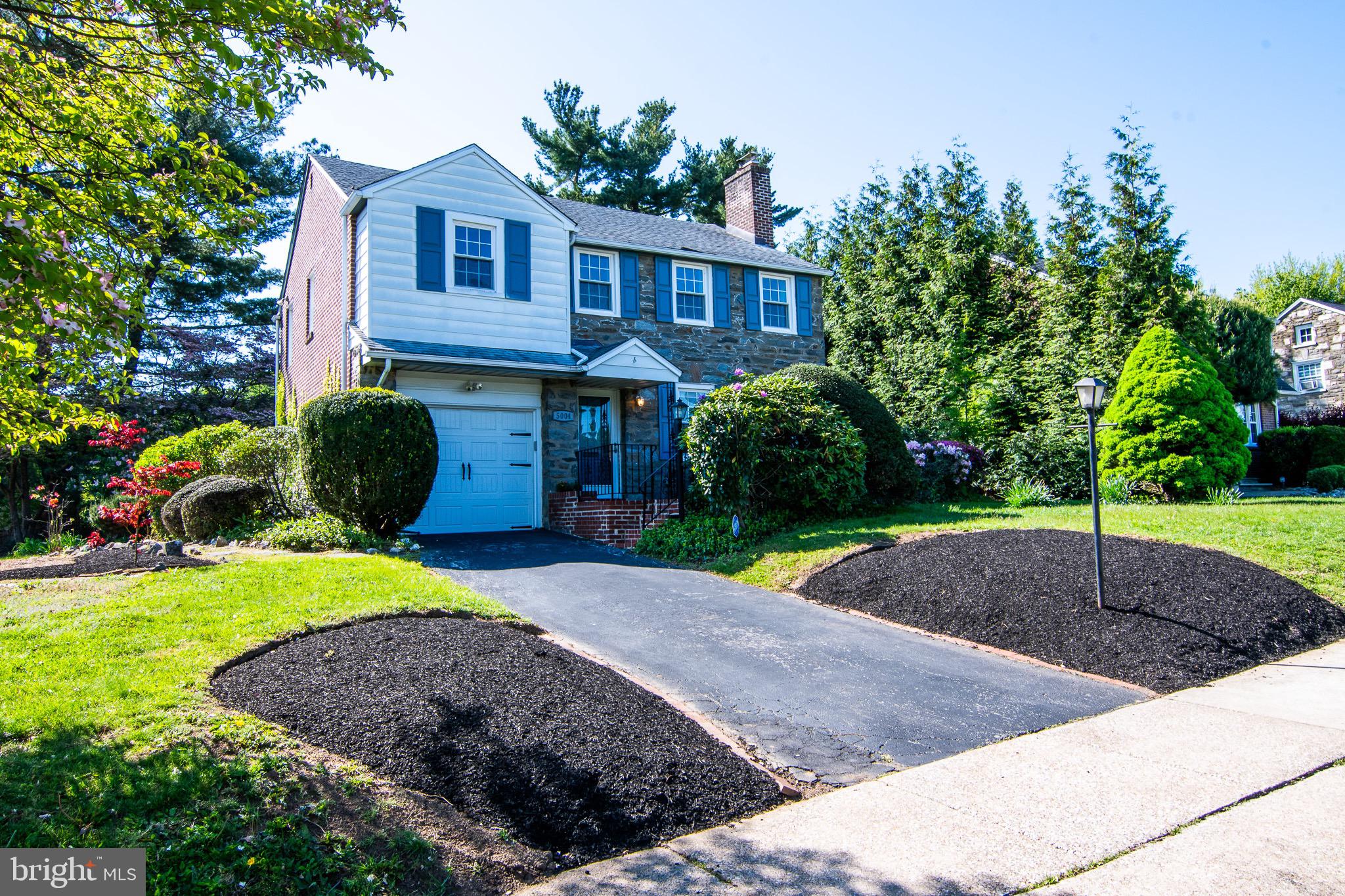 5004 Fairway Road Drexel Hill, PA 19026 - Photo 1 of 29 a front view of a house with a yard and trees