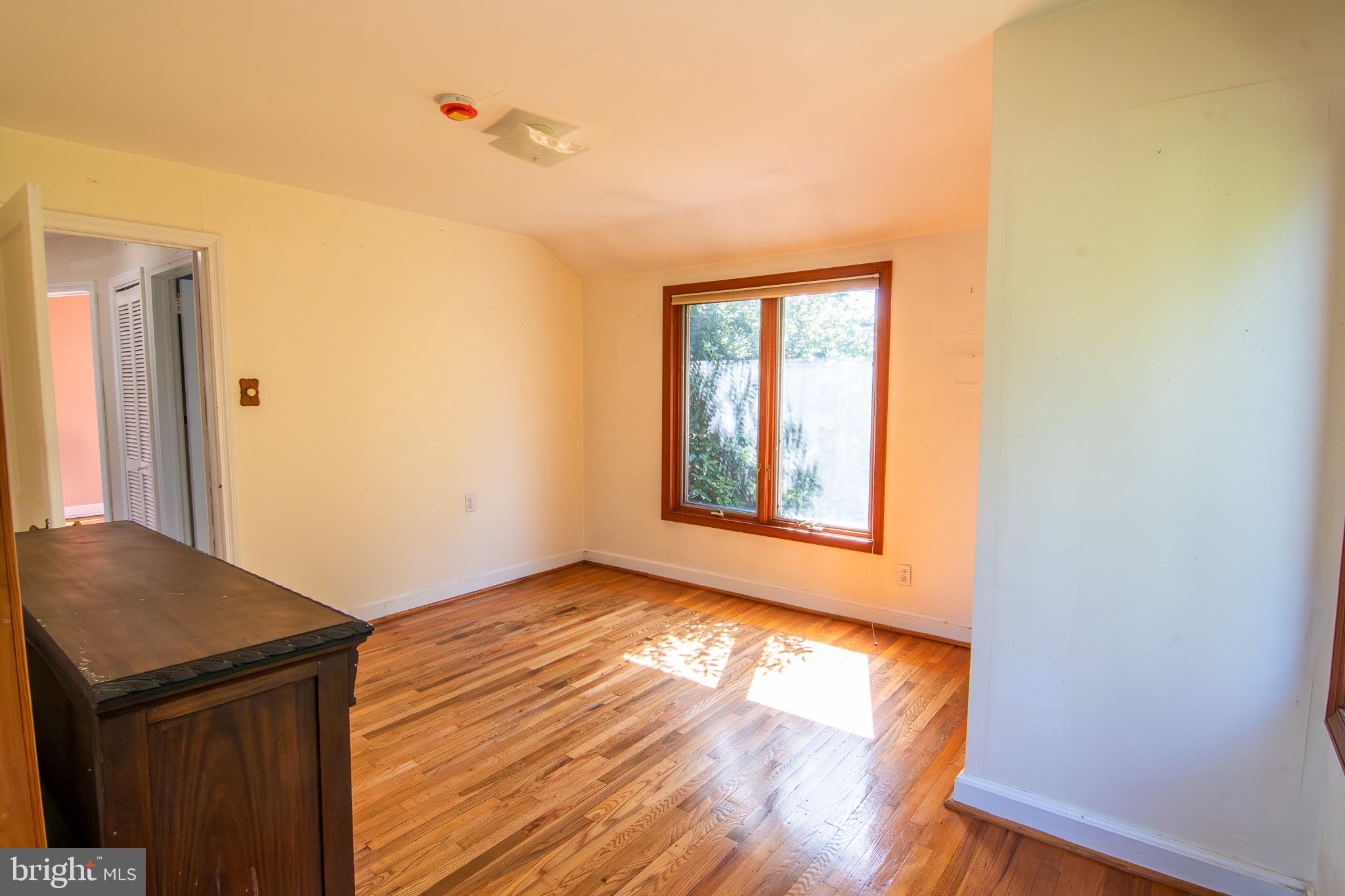 5004 Fairway Road Drexel Hill, PA 19026 - Photo 12 of 29 an empty room with wooden floor and windows