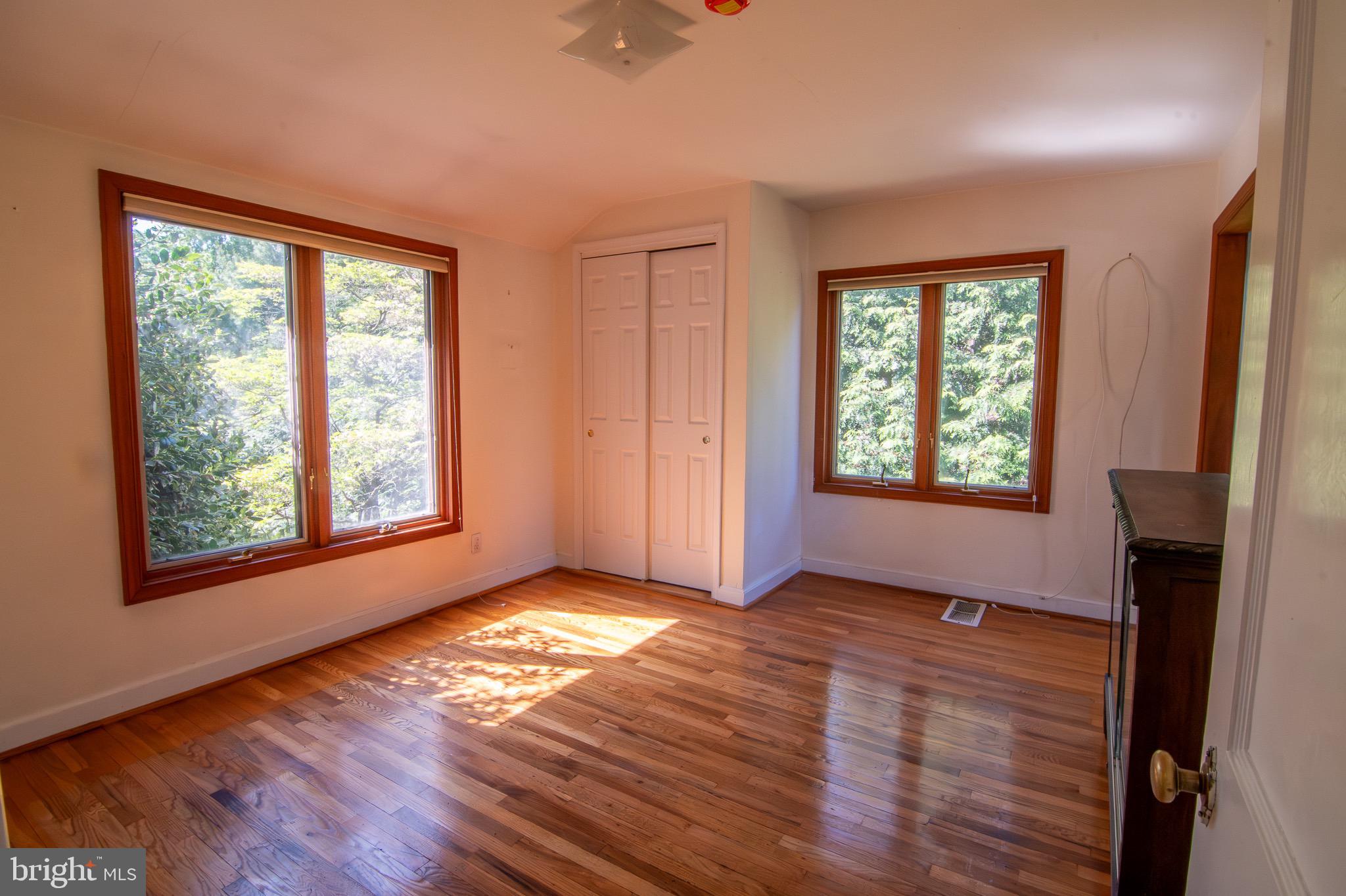 5004 Fairway Road Drexel Hill, PA 19026 - Photo 13 of 29 a view of an empty room with wooden floor and a window