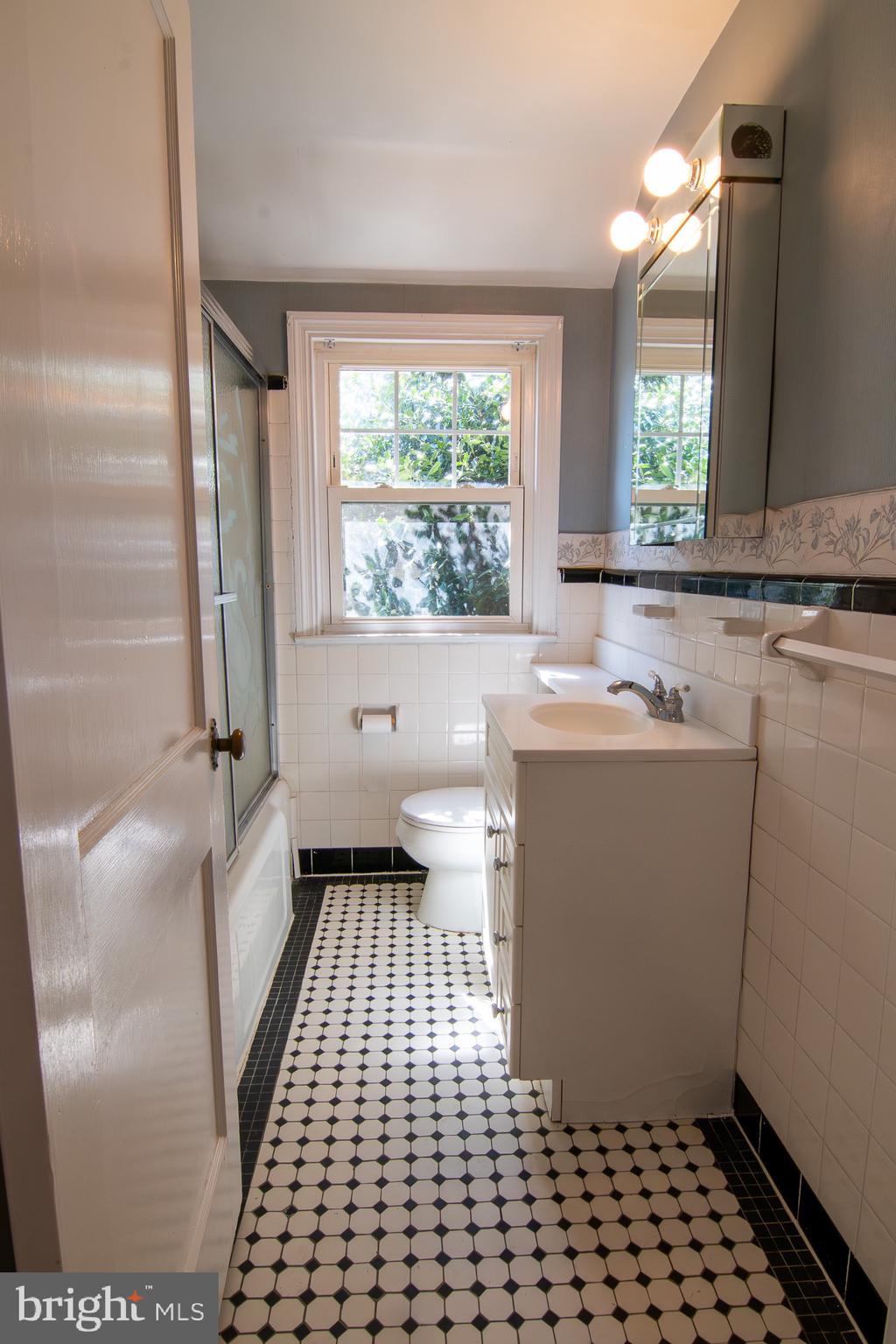 5004 Fairway Road Drexel Hill, PA 19026 - Photo 18 of 29 a bathroom with a sink a toilet a window and vanity
