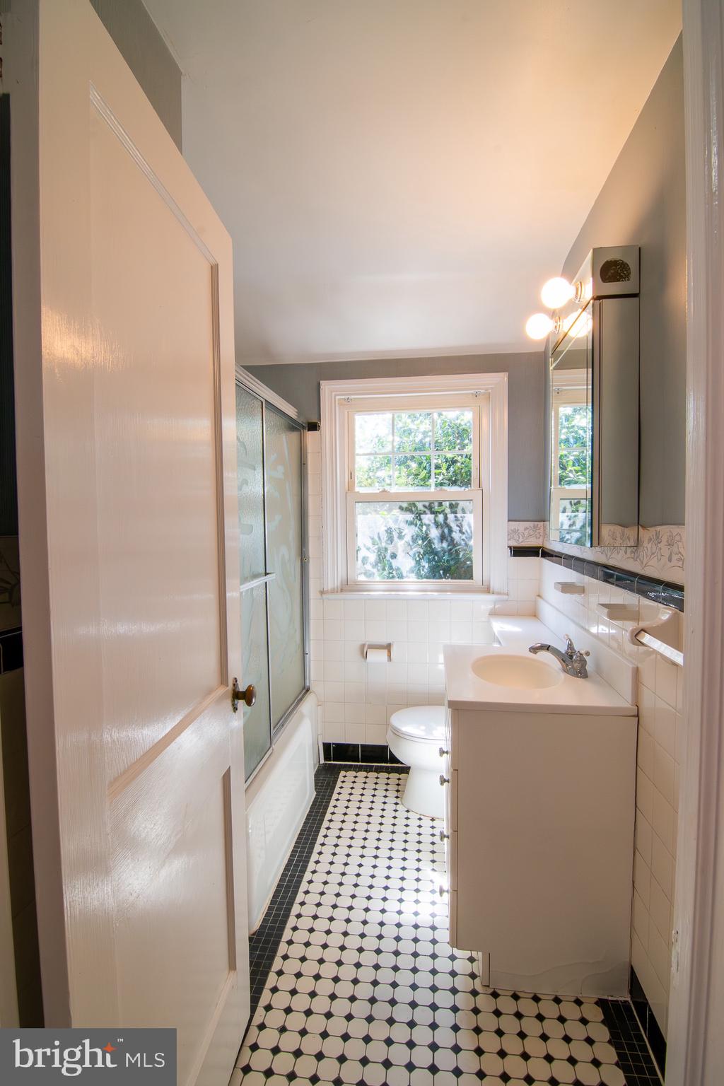 5004 Fairway Road Drexel Hill, PA 19026 - Photo 19 of 29 a bathroom with a sink toilet and shower