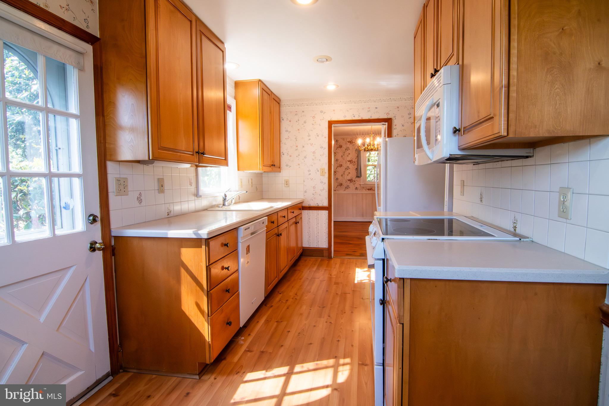 5004 Fairway Road Drexel Hill, PA 19026 - Photo 4 of 29 a kitchen with stainless steel appliances granite countertop a sink a stove and a refrigerator