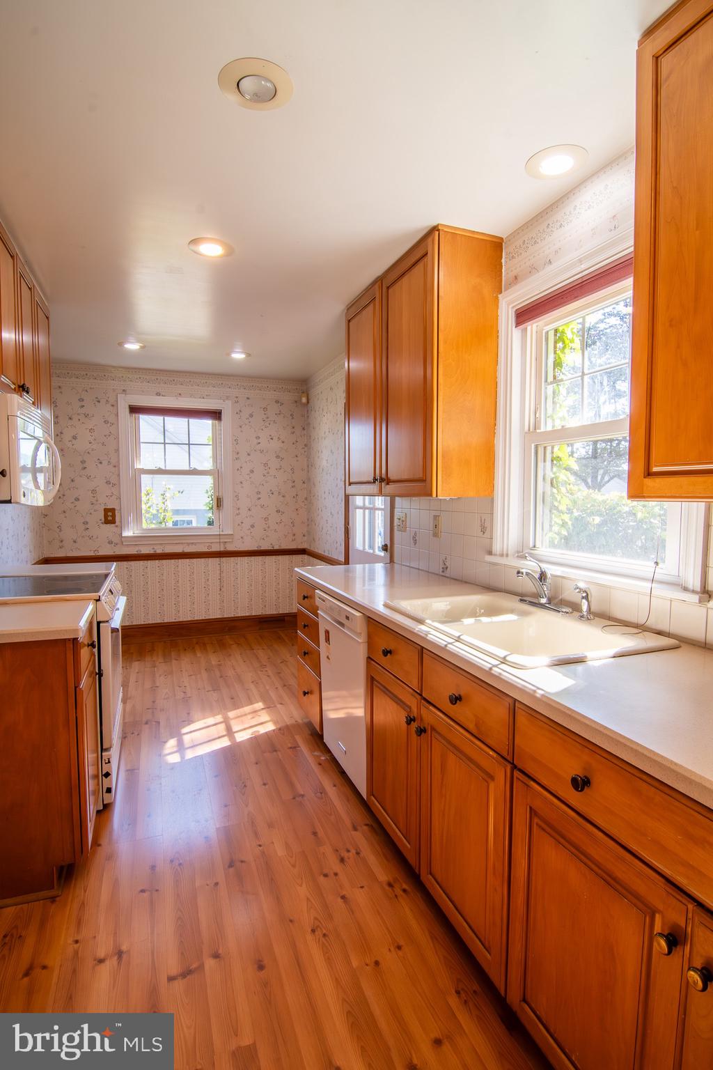 5004 Fairway Road Drexel Hill, PA 19026 - Photo 5 of 29 a view of a kitchen with wooden floor and a sink