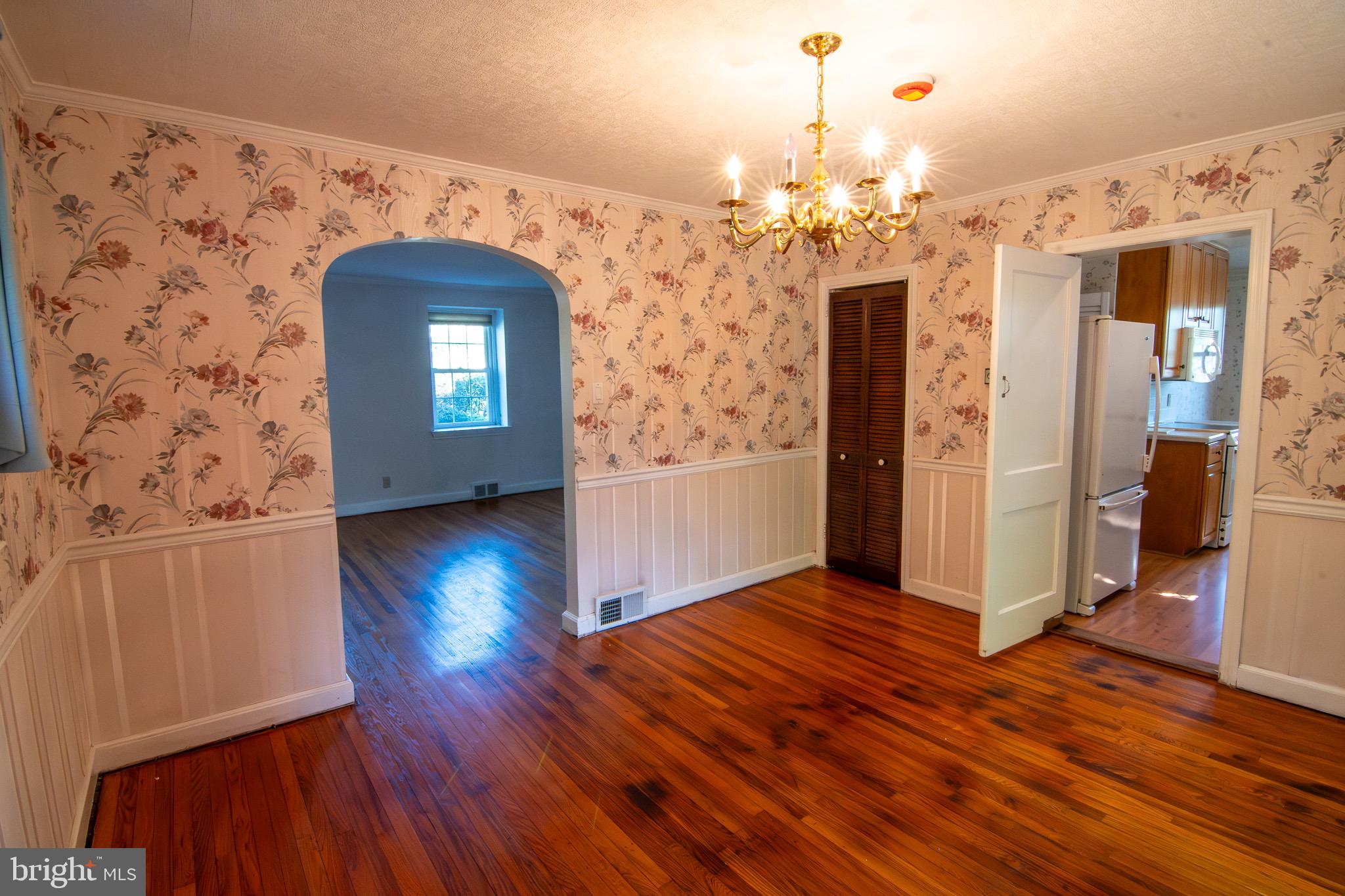 5004 Fairway Road Drexel Hill, PA 19026 - Photo 9 of 29 a view of a livingroom with wooden floor and a kitchen space
