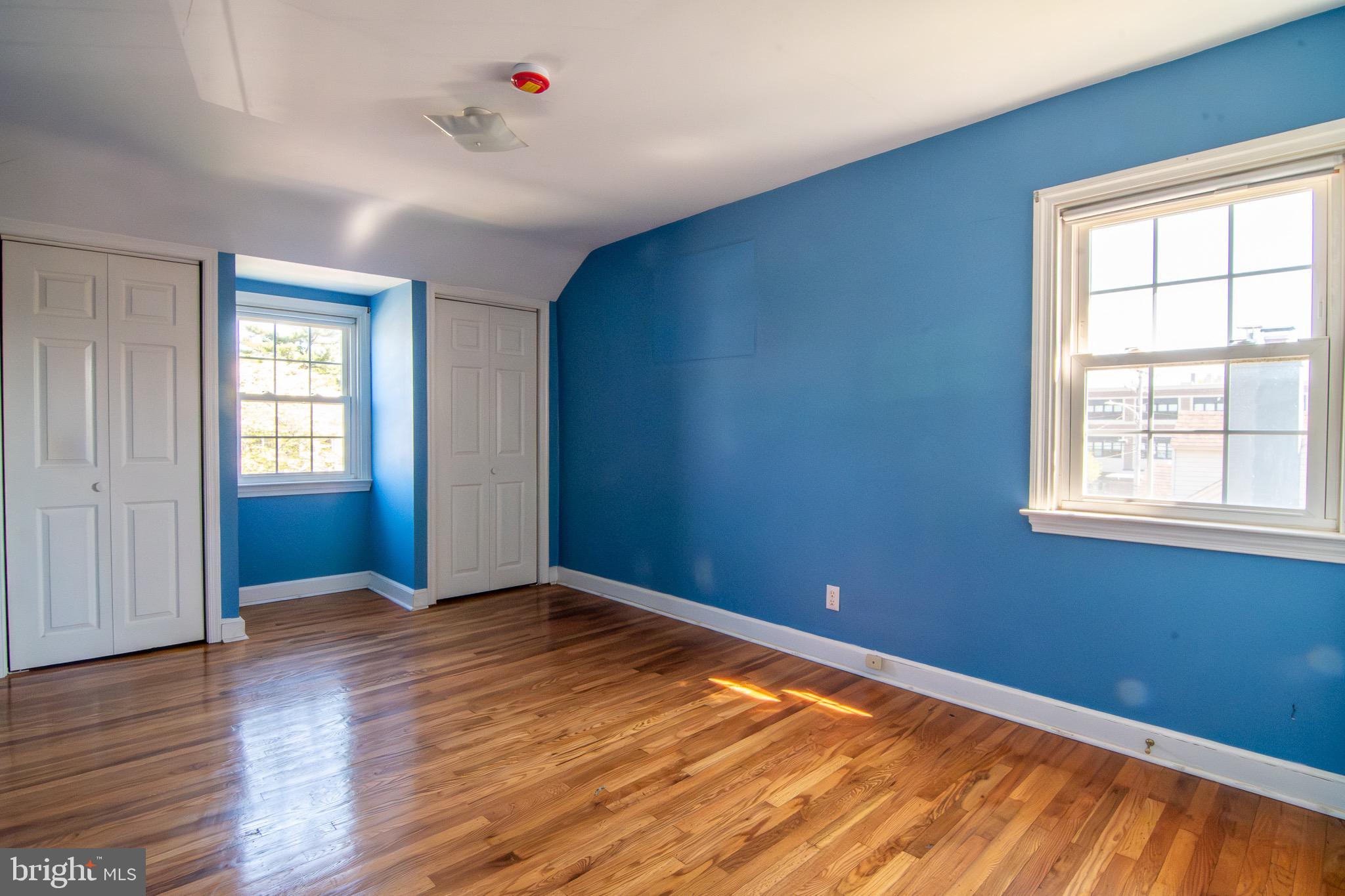 5004 Fairway Road Drexel Hill, PA 19026 - Photo 10 of 29 a view of empty room with wooden floor and fan