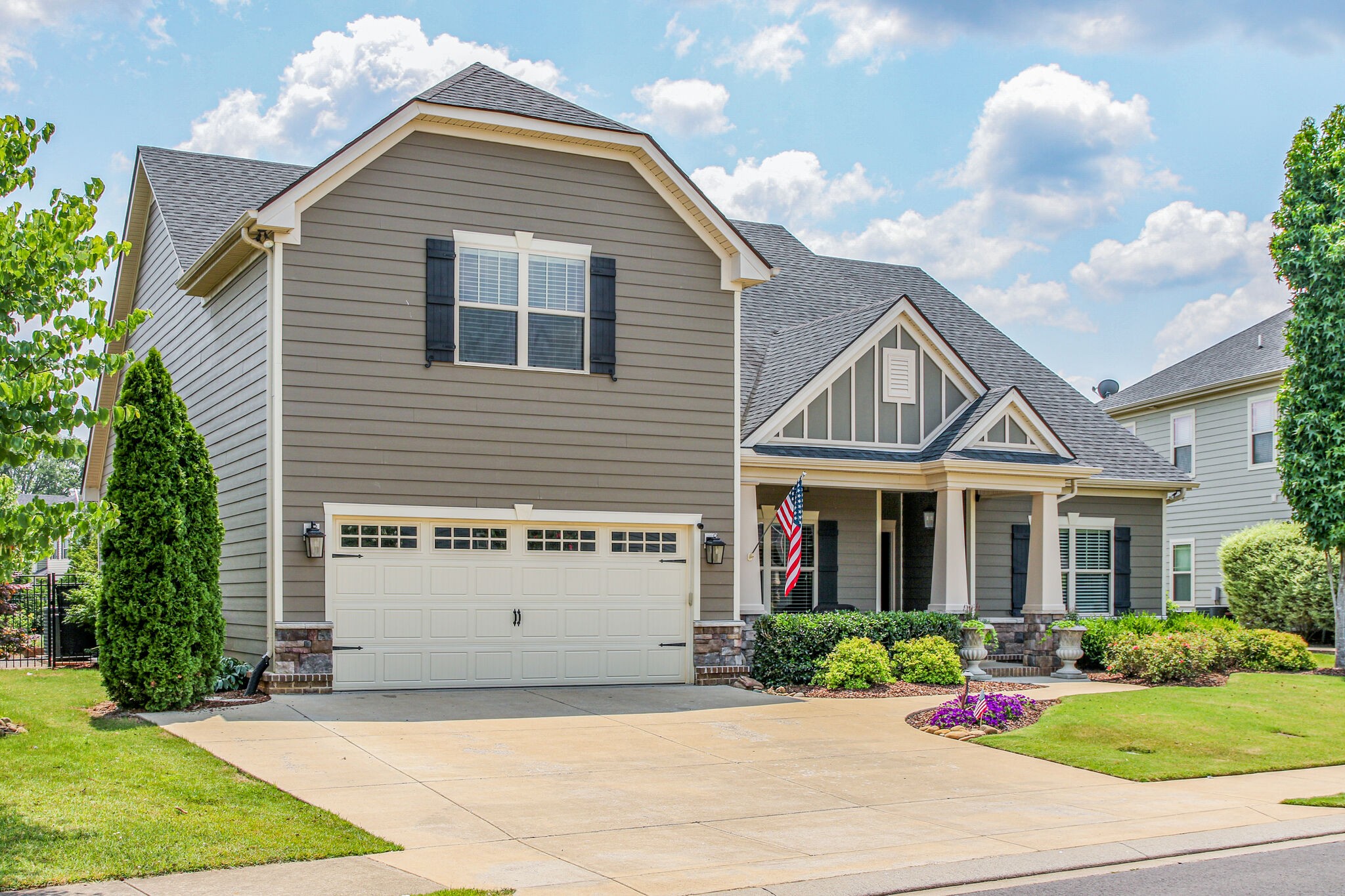 911 Contessa Drive Murfreesboro, TN 37128 - Photo 2 of 42 a view of a white house with a small yard and large tree
