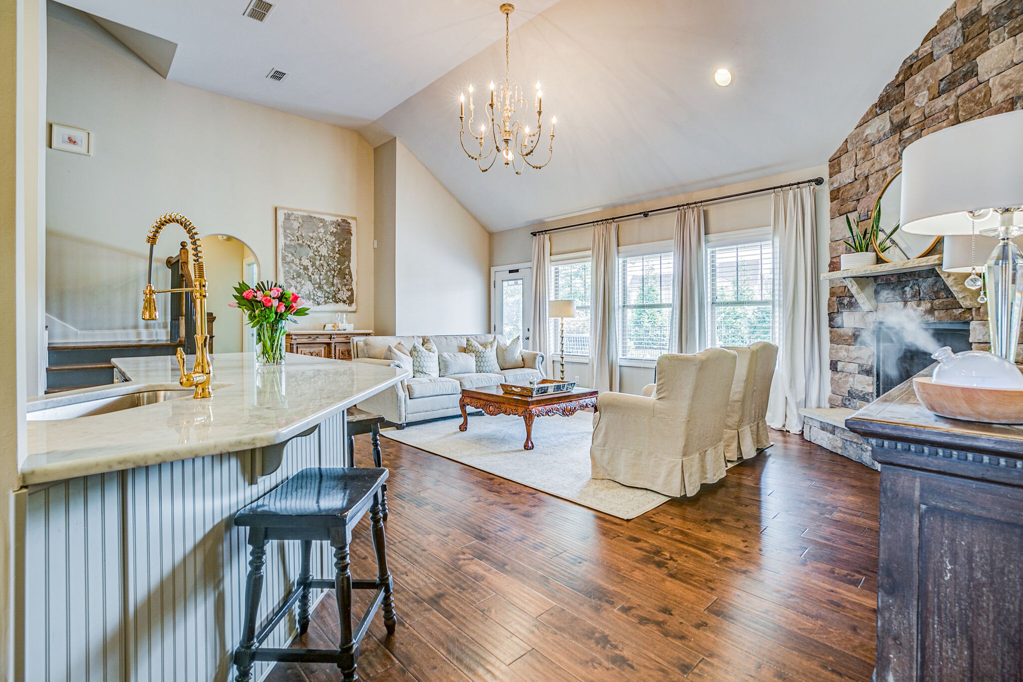 911 Contessa Drive Murfreesboro, TN 37128 - Photo 11 of 42 a living room with furniture a chandelier and a dining table