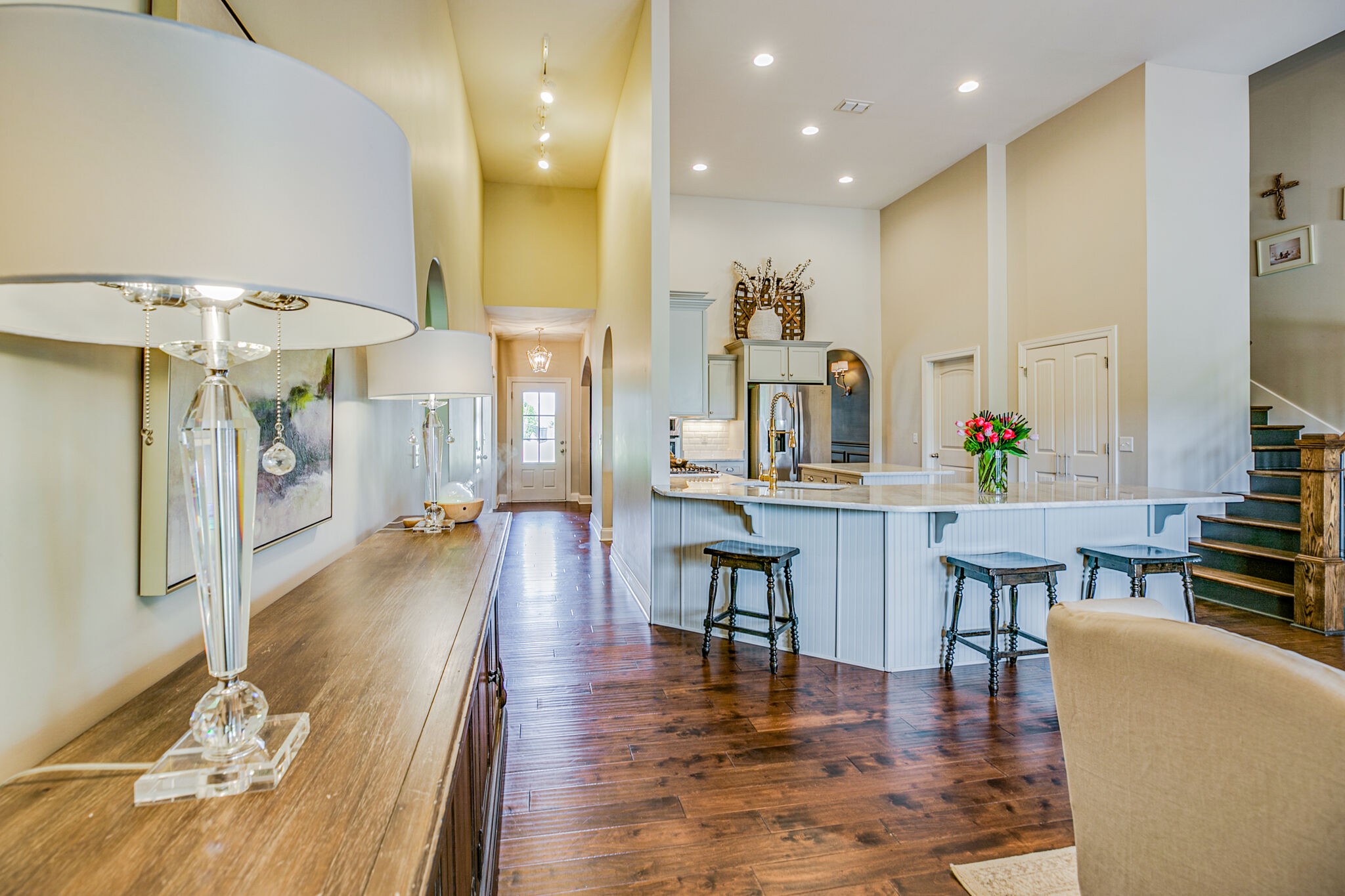 911 Contessa Drive Murfreesboro, TN 37128 - Photo 12 of 42 a living room with furniture kitchen view and a wooden floor