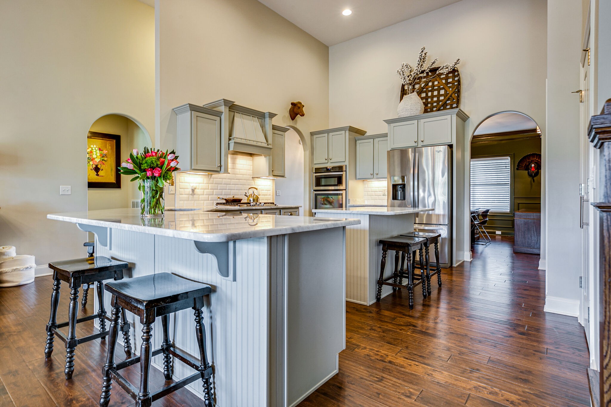911 Contessa Drive Murfreesboro, TN 37128 - Photo 17 of 42 a kitchen with stainless steel appliances a dining table chairs and a refrigerator