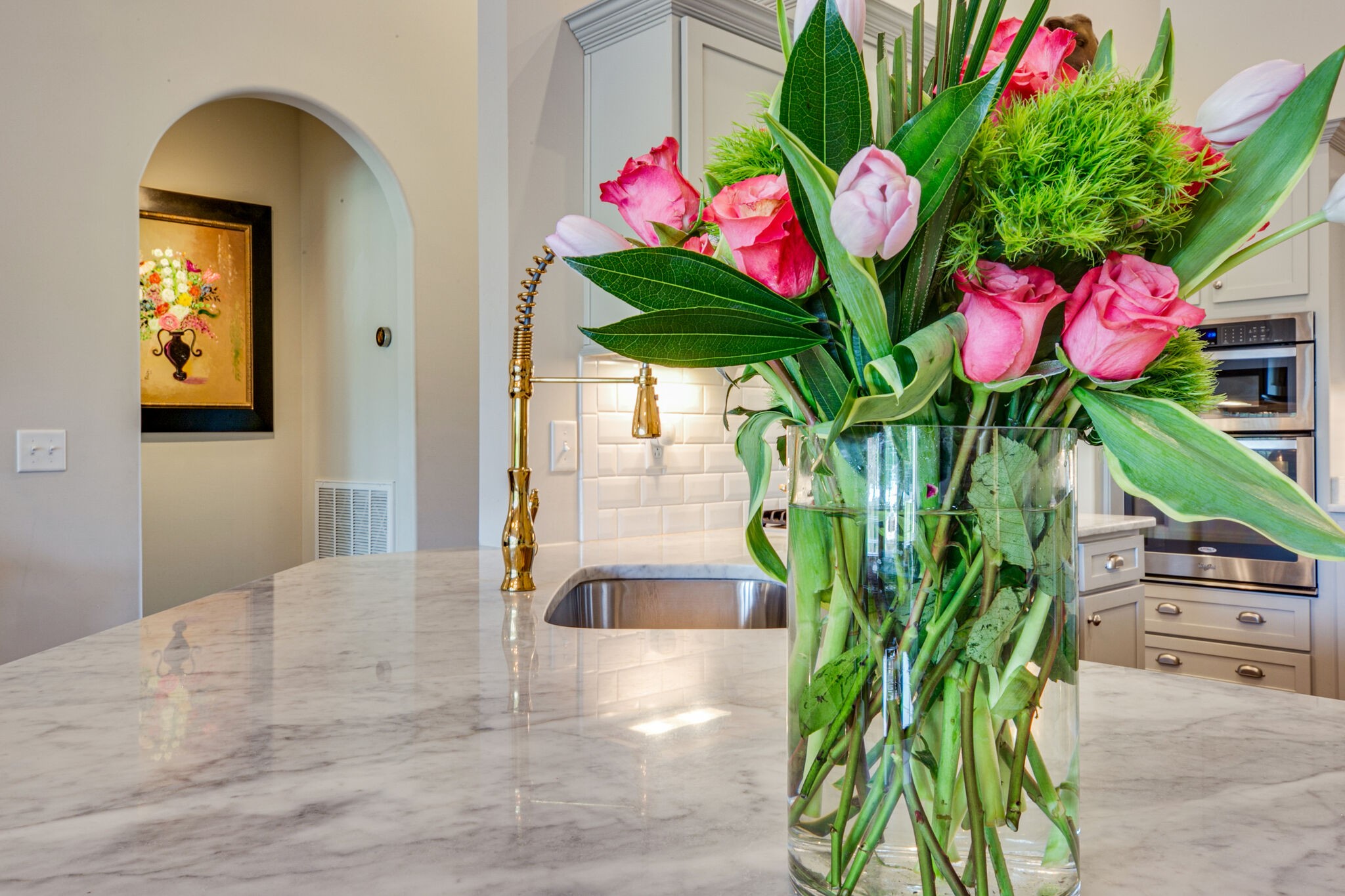 911 Contessa Drive Murfreesboro, TN 37128 - Photo 18 of 42 a vase of flowers sitting on a table with wooden floor